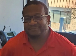 Man wearing glasses and smiling